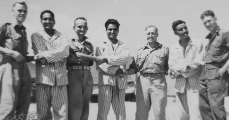 Indian military personnel, including Major Chint Singh (Centre), who survived being prisoners of war in World War 2, pose with Australian soldiers after liberation in Papua New Guinea, 1945. (Source: Firstpost)