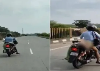 The victim's husband, seen transporting her body after a tragic hit-and-run on a highway near Nagpur