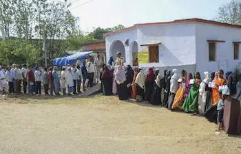Voters wait in queues at a polling station to cast their votes in Bihar’s Gaya district