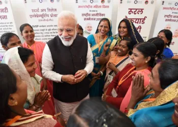 Prime Minister with women at an event (Old Photo)
