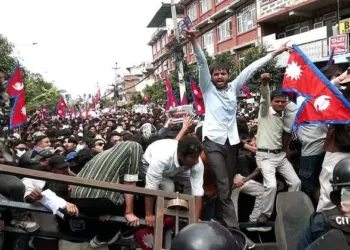 Protestors clash with the riot police outside the Parliament building in Kathmandu, Nepal