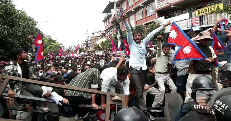 Protestors clash with the riot police outside the Parliament building in Kathmandu, Nepal