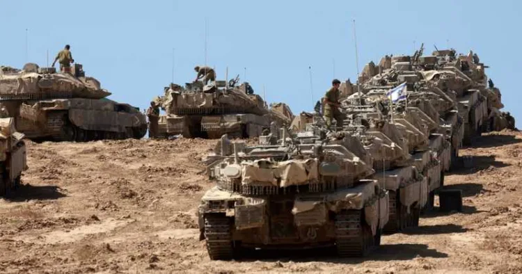 A convoy of Israeli tanks is deployed at Israel's border with the Gaza Strip on September 16, 2025