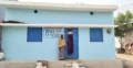 A representative image - A woman beneficiary outside his house built under PM Aawas Yojna courtesy PMAY