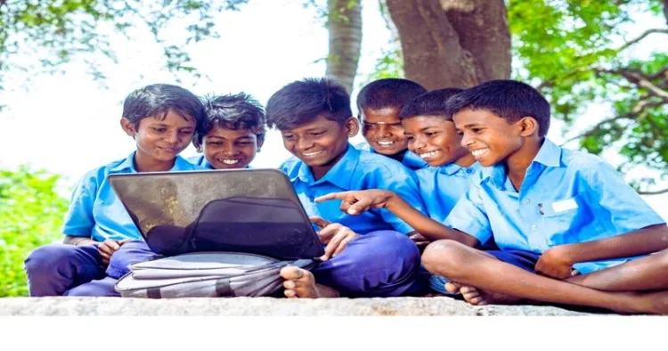 School children working on the laptop