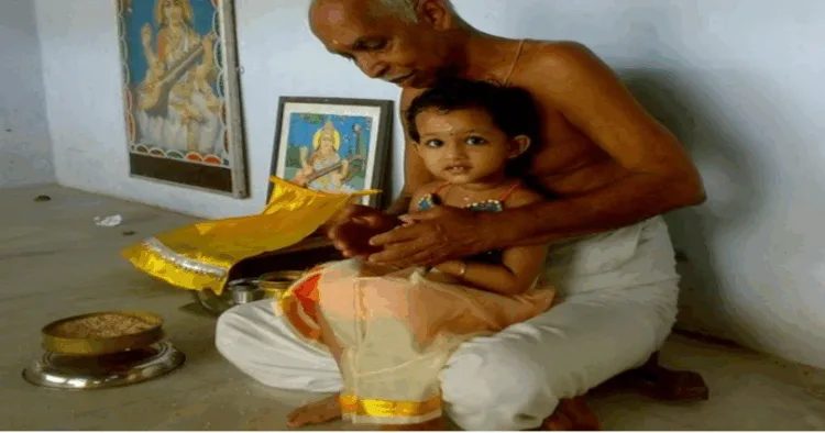 A child in the lap of acharya