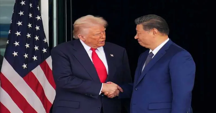 US President Donald Trump (left) and Chinese President Xi Jinping (right) shake hands as they depart from a bilateral meeting at Gimhae Air Base in Busan, South Korea, on Oct. 30