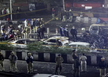 New Delhi, Nov 10 (ANI): Police officers and forensic technicians work at the site of the blast in a Hyundai i20 car near Gate No. 1 of the Red Fort Metro station, in Delhi on November 10. (Reuters/ANI Photo)
