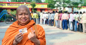 Gaya, Nov 11 (ANI): A monk shows his ink-marked finger after casting his vote for the second phase of the Bihar assembly election, in Gaya on Tuesday. (@CEOBihar X/ANI Photo)