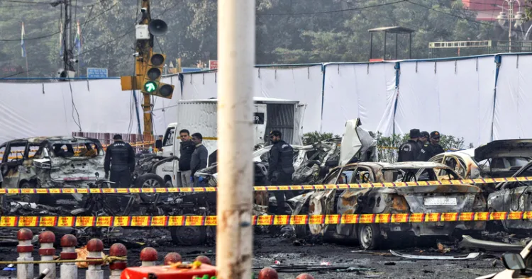 New Delhi, Nov 11 (ANI): National Security Guard (NSG) personnel investigate the site of the blast in a Hyundai i20 car near Gate no 1 of the Red Fort Metro station, in Delhi on Tuesday. (ANI Photo)