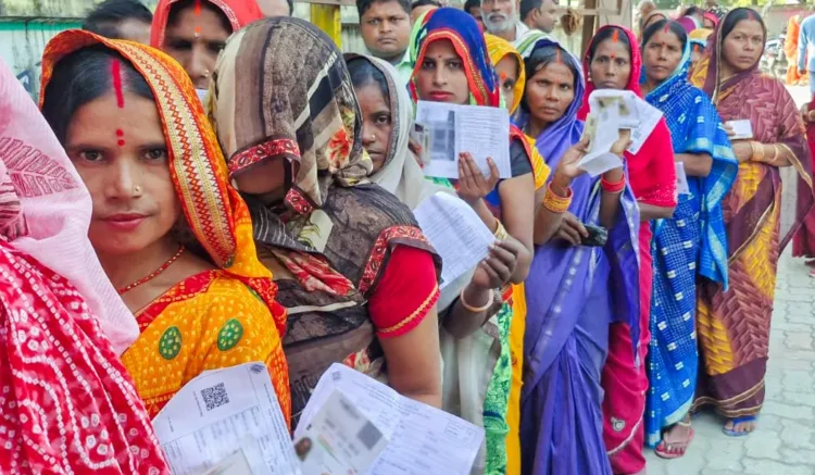 Women voters wait in a queue to cast their vote for the second phase of the Bihar assembly election, in West Champaran on Tuesday. (@CEOBiharX/ANI Photo)