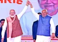 Prime Minister Narendra Modi on stage shares his joy with Chief Minister Nitish Kumar in Patna’s historic Gandhi Maidan