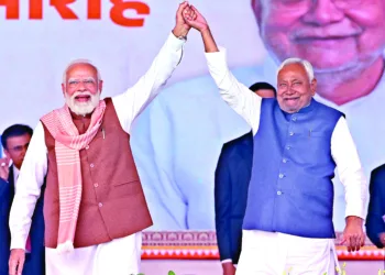 Prime Minister Narendra Modi on stage shares his joy with Chief Minister Nitish Kumar in Patna’s historic Gandhi Maidan