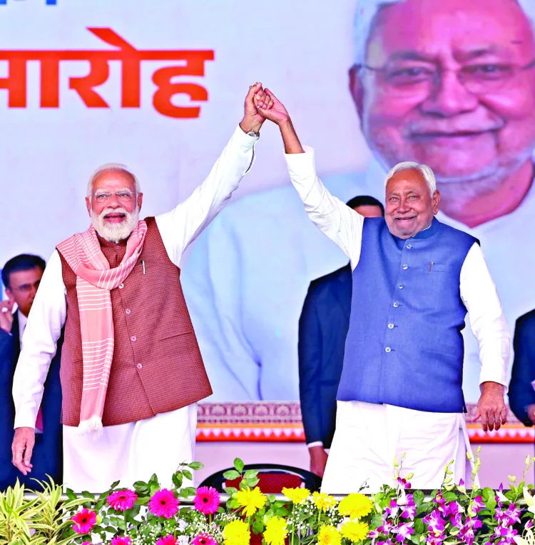 Prime Minister Narendra Modi on stage shares his joy with Chief Minister Nitish Kumar in Patna’s historic Gandhi Maidan