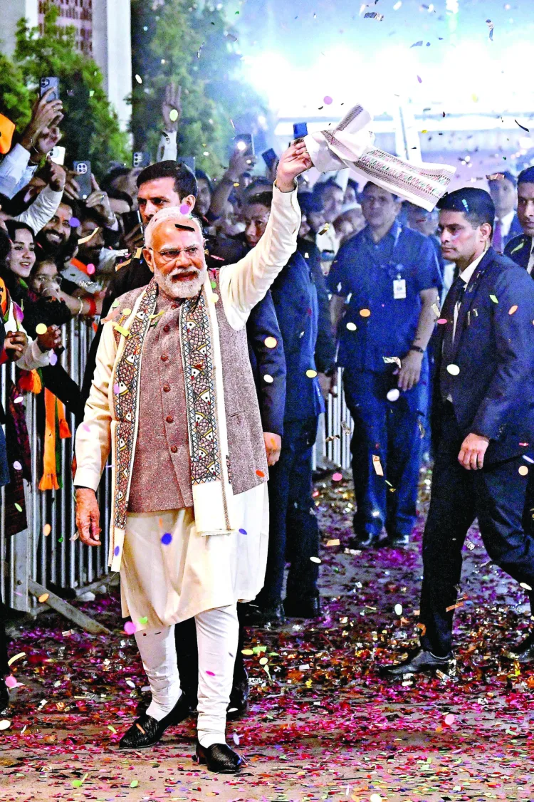 New Delhi, Nov 14 : Prime Minister Narendra Modi greets the supporters as the National Democratic Alliance (NDA) wins the Bihar Assembly elections, at BJP headquarters, in New Delhi on Friday