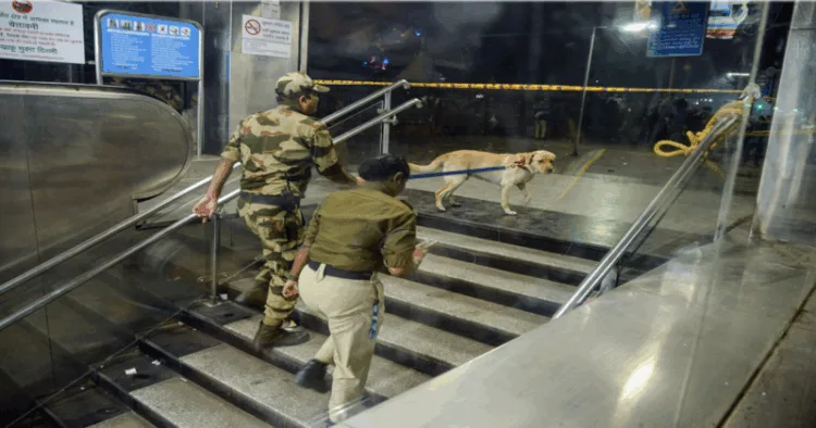 Security personnel with sniffer dogs at the Red Fort metro station