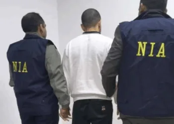 NIA officials with Anmol Bishnoi