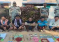 Arrested Maoists with seized arms