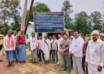 Villagers of Bansla and Junwani in Kanker district stand united beneath a warning board prohibiting entry of Pastors