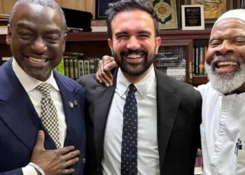 As funding questions grow, Mamdani now faces renewed criticism over his public admiration for Imam Siraj Wahhaj (Right)