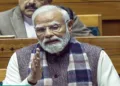 New Delhi, Dec 08 (ANI): Prime Minister Narendra Modi speaks in Lok Sabha during the winter session of Parliament, in New Delhi on Monday. (Sansad TV/ANI Video Grab)