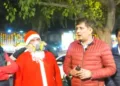 The clip features two men dressed as Santa Claus, with anti-pollution masks on, collapsing on the streets of Connaught Place