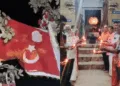 Muslim flags (Left) - - Hindu devotees (right)