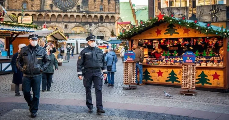 Police officers patrol the annual Christmas market in Magdeburg, Germany. On December 20, 2024, Taleb al-Abdulmohsen drove a car into a crowded open-air market, killing six people and injuring more than 300.
