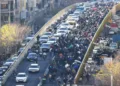 Protesters march through downtown Tehran on Monday against the theocratic rule of Ayatollah Ali Khamenei