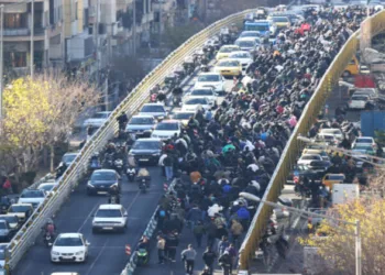 Protesters march through downtown Tehran on Monday against the theocratic rule of Ayatollah Ali Khamenei