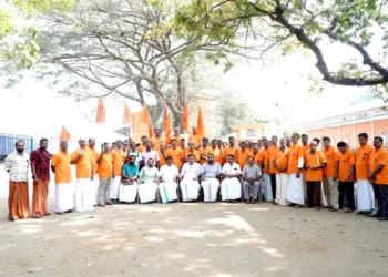 Seventy five  labourers of Angadippuram FCI Godown after receiving BMS membership.