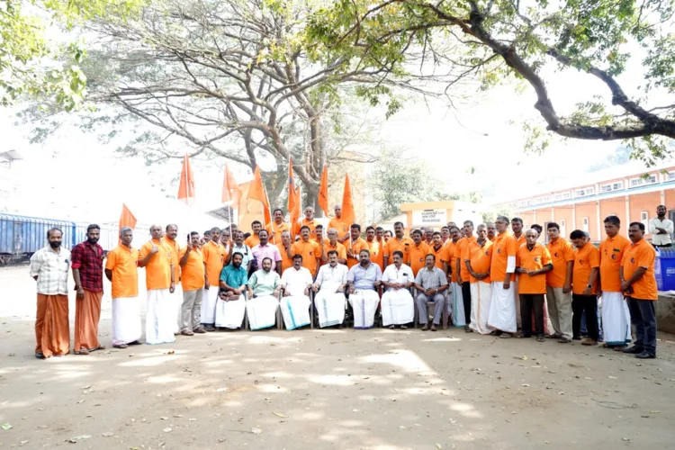 Seventy five  labourers of Angadippuram FCI Godown after receiving BMS membership.