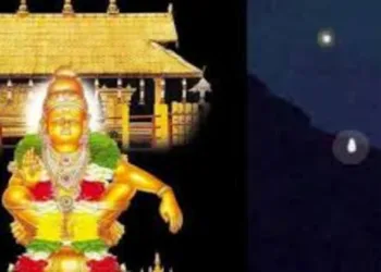 Devotees wait in silent reverence as the Makara Jyoti appears in the distant hills, marking the most awaited moment of the pilgrimage season at Sabarimala