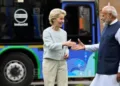 EU Commission President Ursula von der Leyen greets Prime Ministe Modi in New Delhi in March 2025, with a hydrogen-fuelled bus used by EU commissioners seen in the background at Hyderabad House