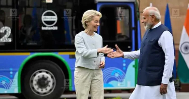 EU Commission President Ursula von der Leyen greets Prime Ministe Modi in New Delhi in March 2025, with a hydrogen-fuelled bus used by EU commissioners seen in the background at Hyderabad House