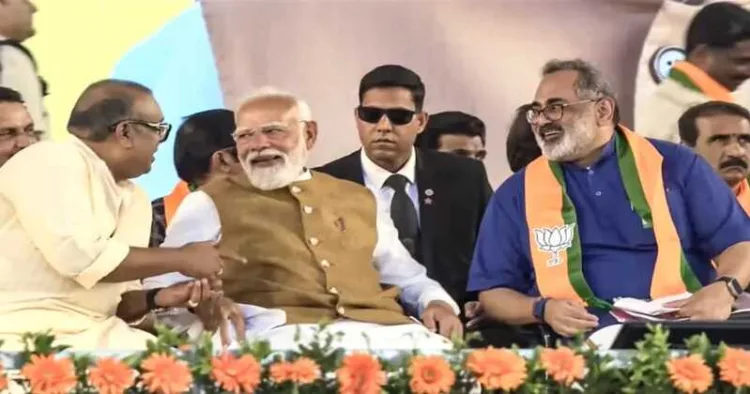 PM Modi interacts with BDJS leader and SNDP Yogam vice president Thushar Vellappalli during a public rally, in Thiruvananthapuram, Kerala. BJP state president Rajeev Chandrasekhar is also seen