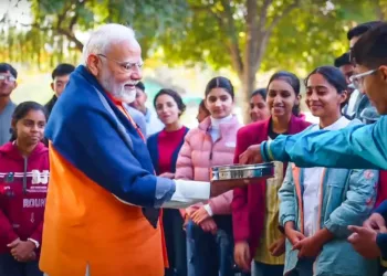 Prime Minister Narendra Modi distributes sweets among students while interacting with them on different aspects of stress-free exams under Pariksha Pe Charcha program in New Delhi (Photo: Old Image used for representative purposes)