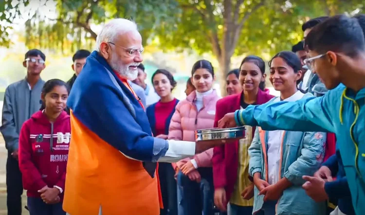 Prime Minister Narendra Modi distributes sweets among students while interacting with them on different aspects of stress-free exams under Pariksha Pe Charcha program in New Delhi (Photo: Old Image used for representative purposes)