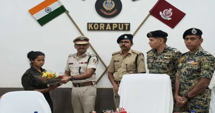 ACM-ranked Maoist Mamata Podiami surrenders to senior police officials in Koraput.