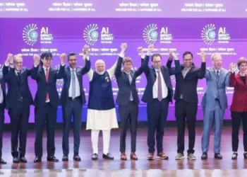 Prime Minister Narendra Modi (centre) joins hands with Google CEO Sundar Pichai, OpenAI CEO Sam Altman and others during the India AI Impact Summit 2026, in New Delhi. | Photo: YouTube/@NarendraModi