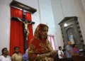 A converted woman standing inside the Church (Representative image)