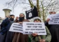Islamists protest outside London Central Mosque, London, as a placard reads, “Geneva II will not stop the implementation of the Khilafah"