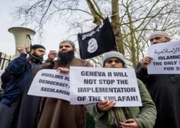 Islamists protest outside London Central Mosque, London, as a placard reads, “Geneva II will not stop the implementation of the Khilafah"