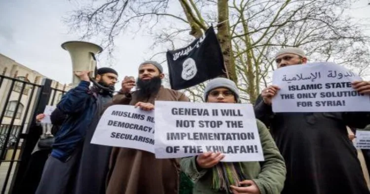 Islamists protest outside London Central Mosque, London, as a placard reads, “Geneva II will not stop the implementation of the Khilafah"