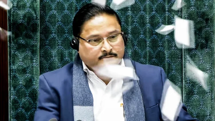 Opposition MPs throw papers towards the Presiding officer Dilip Saikia during an uproar after Lok Sabha LoP Rahul Gandhi sought to quote an article citing former Army Chief MM Naravane’s unpublished book
