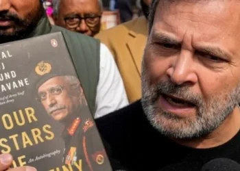 LoP Rahul Gandhi speaks to the media as he shows a copy of the 'unpublished' memoir of former Army chief General M M Naravane outside the Parliament House in New Delhi