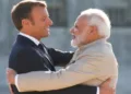 French President Emmanuel Macron welcomes Prime Minister Narendra Modi before a meeting at the Chateau of Chantilly, near Paris, France in August 2019