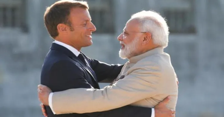 French President Emmanuel Macron welcomes Prime Minister Narendra Modi before a meeting at the Chateau of Chantilly, near Paris, France in August 2019