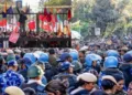 Heavy police deployment formed a barricade at the JNU entrance on Thursday as a large crowd of left activists gathered, reflecting the escalating tension on campus