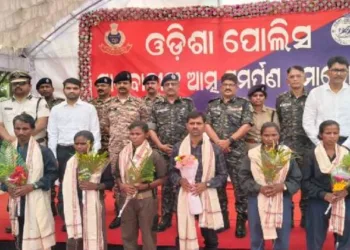 Maoist cadres lay down their arms before Odisha DGP Yogesh Bahadur Khurania in the presence of senior police and paramilitary officers during a surrender programme